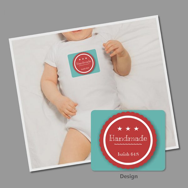 Image of a Christian babygrow featuring Isaiah 64:8 and the word Handmade in a rosette design.